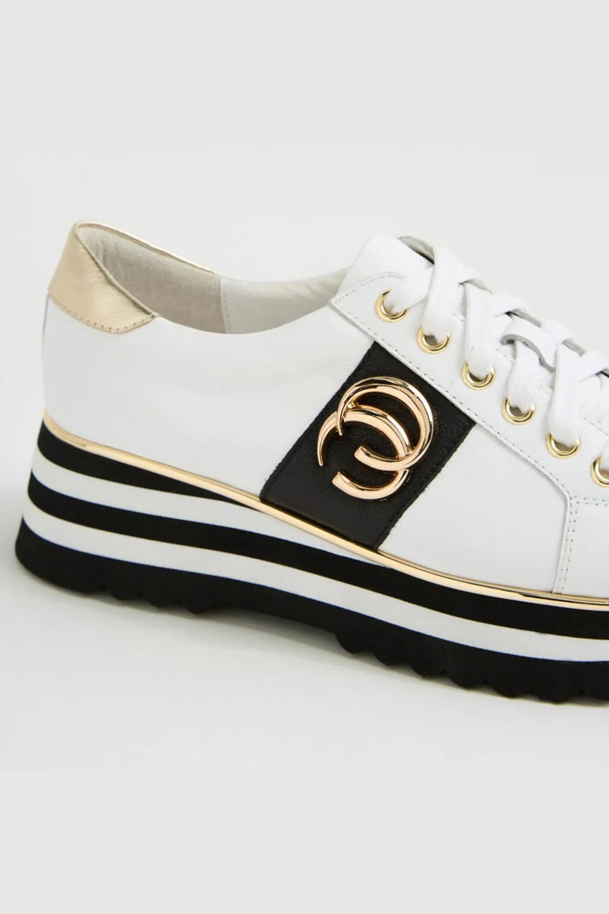 Edgey Leather Platformed Sneakers in White Black